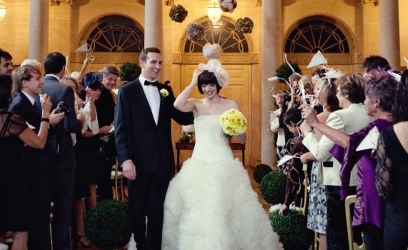 Couple walk down the aisle at the Assembly Rooms